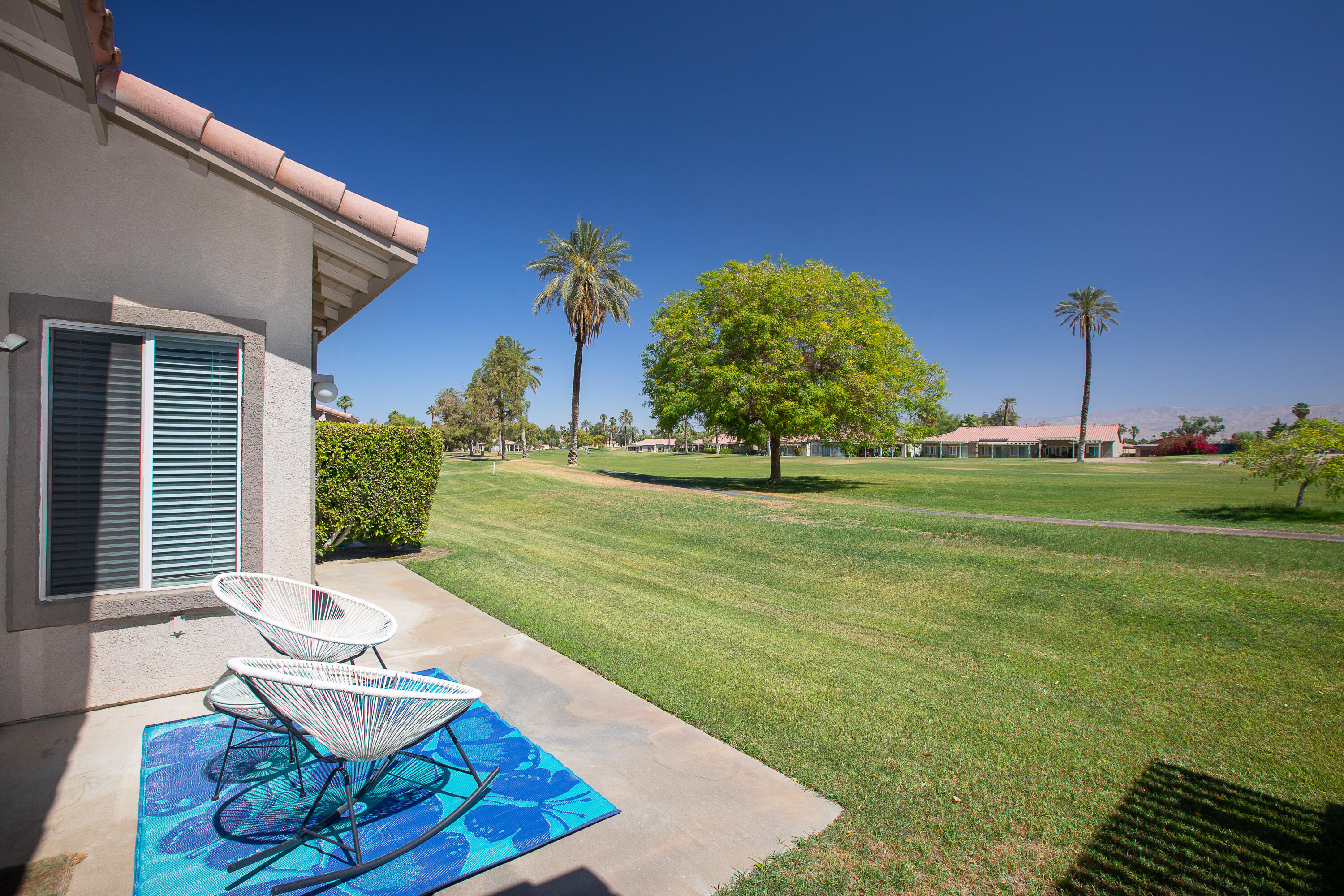 82368 Lancaster Way Indio, CA 92201 - Photo 24 of 35 a view of a two chairs in the patio