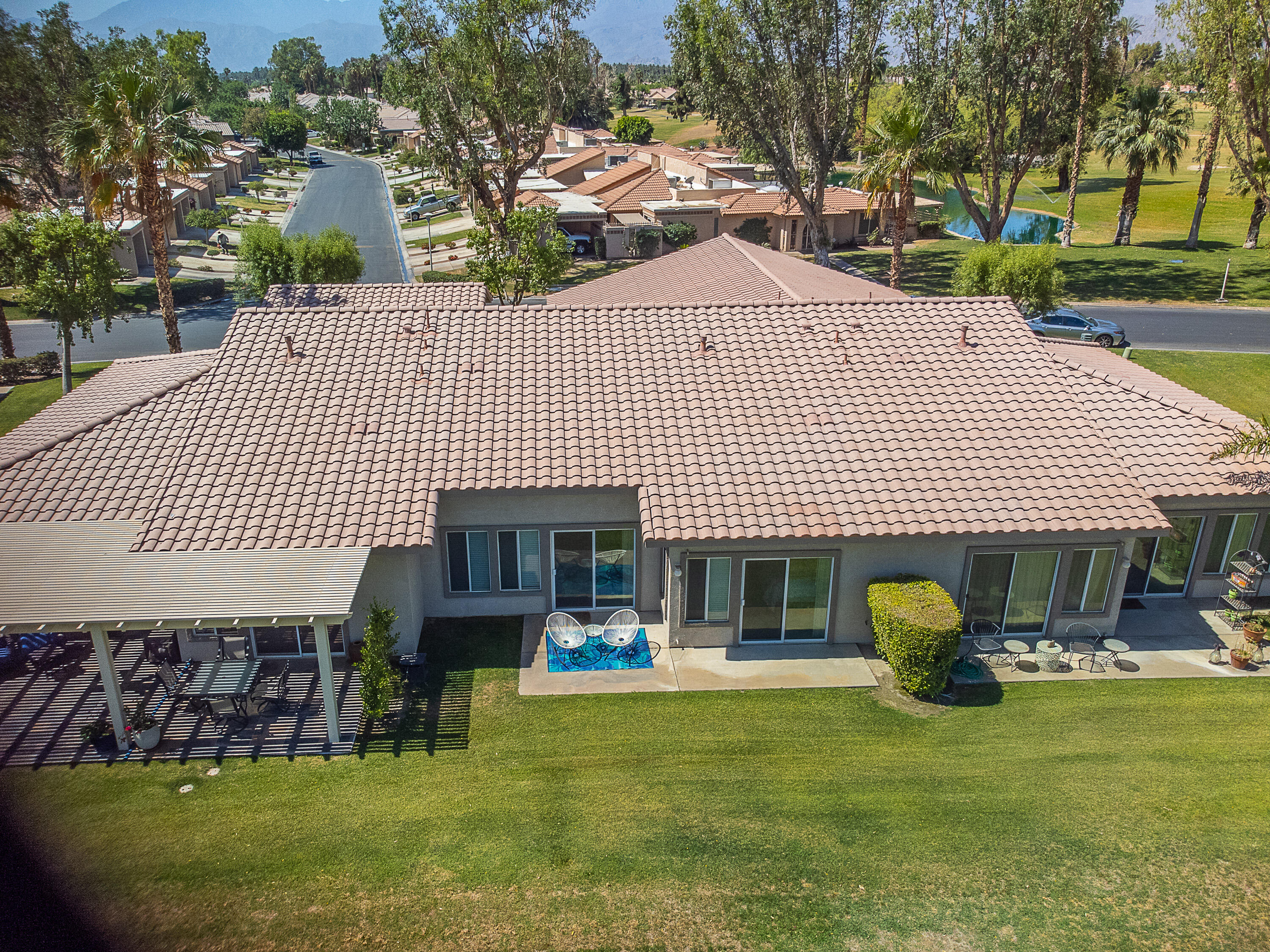 82368 Lancaster Way Indio, CA 92201 - Photo 30 of 35 a front view of a house with garden