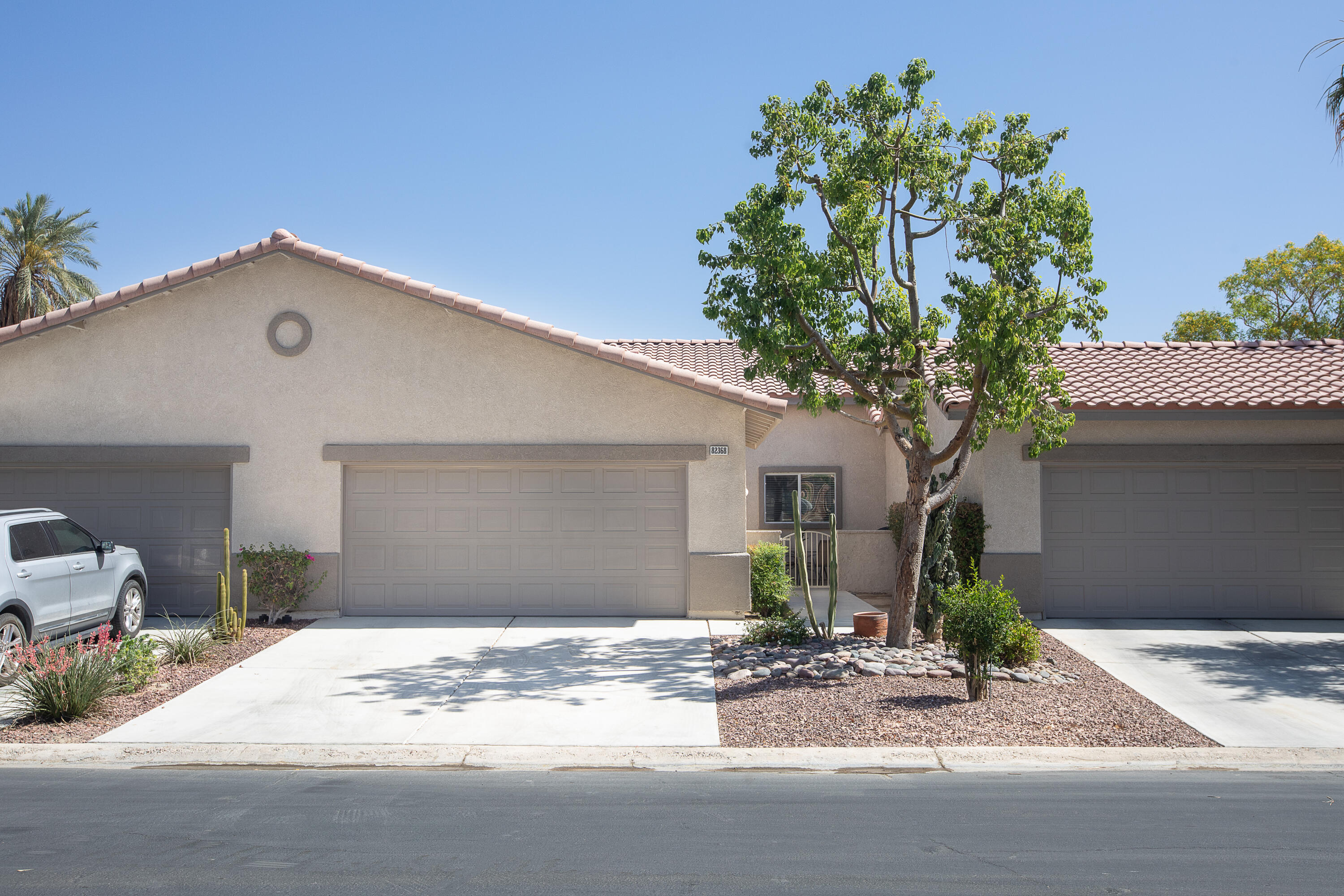 82368 Lancaster Way Indio, CA 92201 - Photo 3 of 35 a front view of a house with a yard