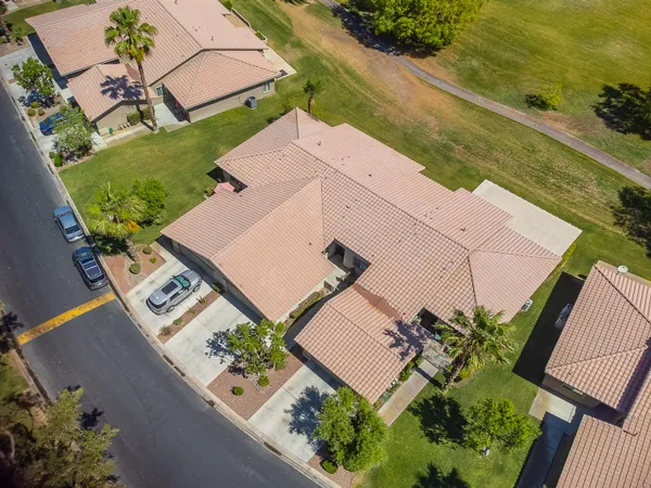 an aerial view of a house with a garden