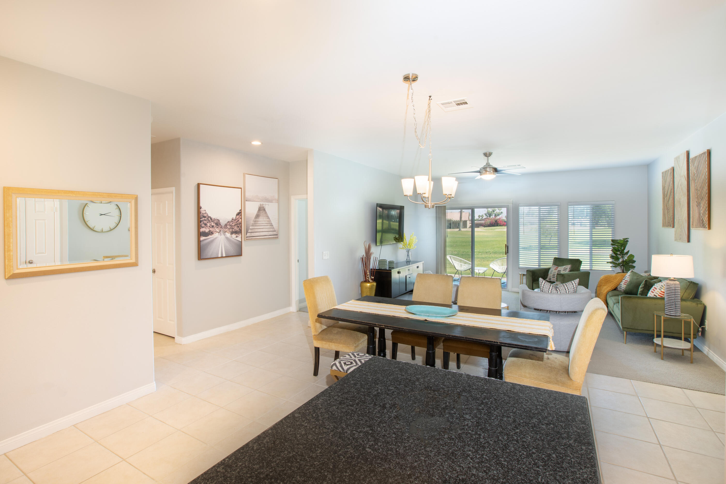 82368 Lancaster Way Indio, CA 92201 - Photo 4 of 35 a room with lots of furniture and a chandelier