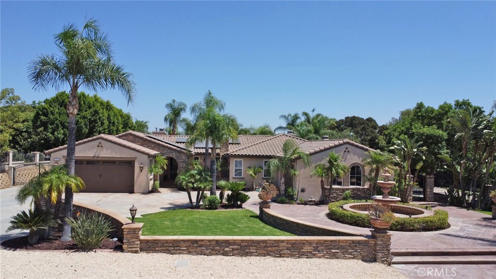 a front view of a house with garden and porch