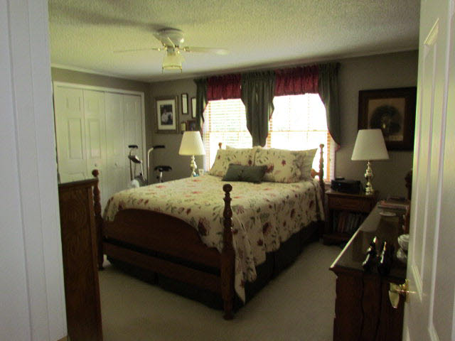 7670 Briery Branch Road Dayton, VA 22821 - Photo 8 of 14 a bedroom with a bed and window
