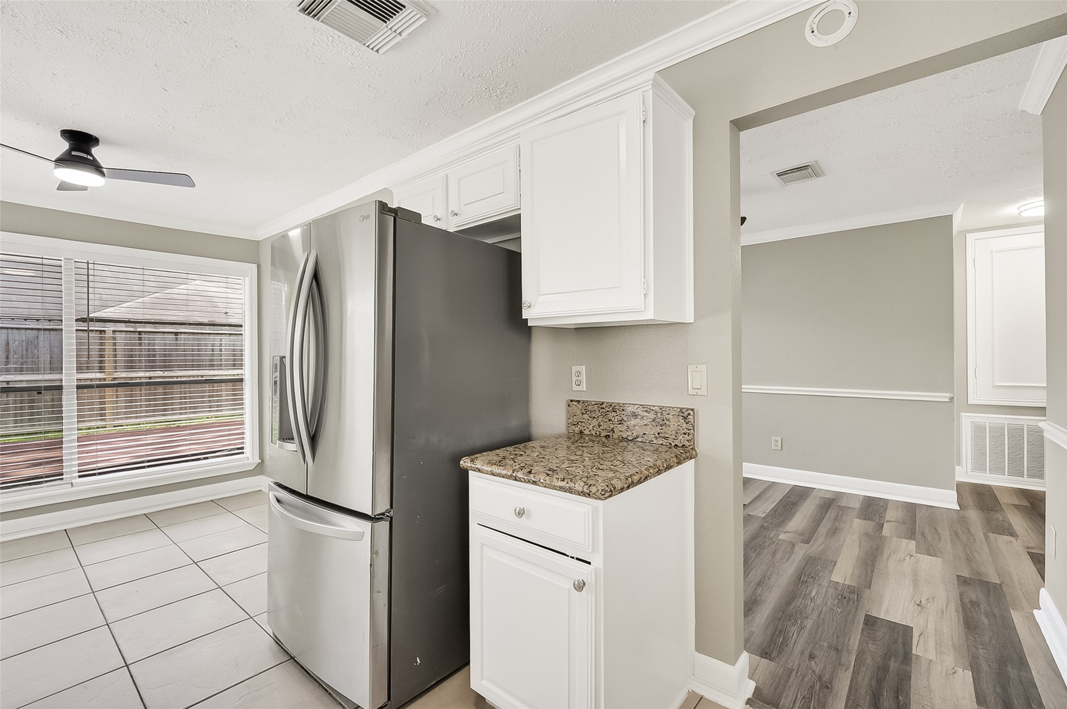 12403 Meadow Ridge Drive Stafford, TX 77477 - Photo 15 of 47 a kitchen with a refrigerator and cabinets