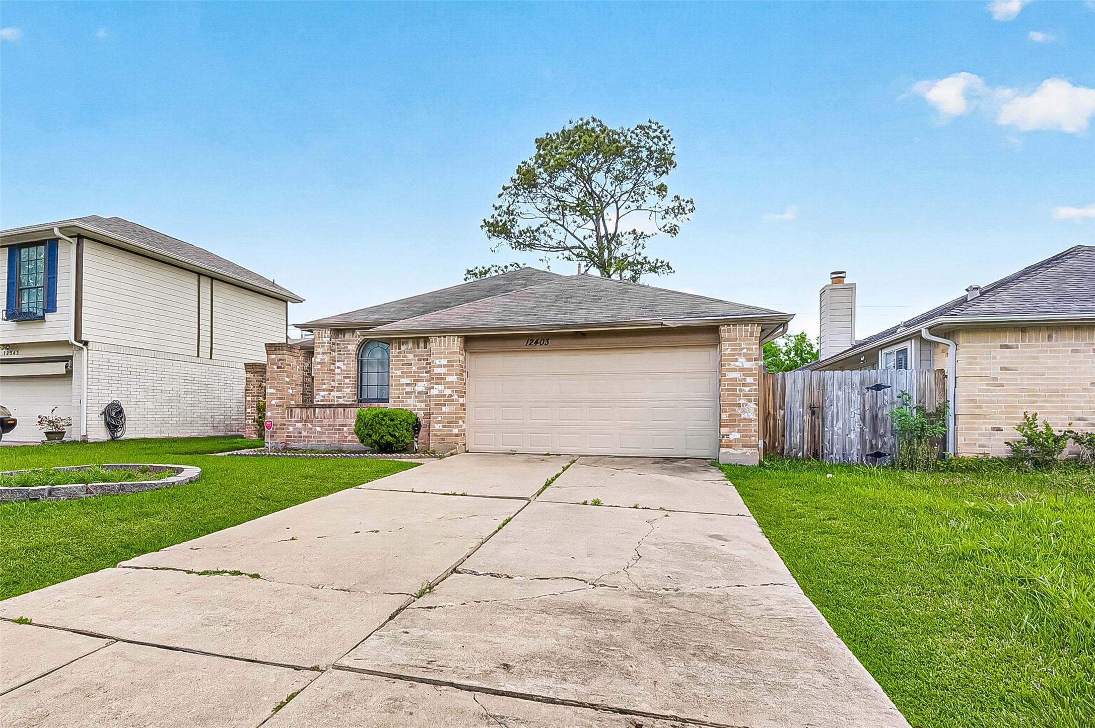 12403 Meadow Ridge Drive Stafford, TX 77477 - Photo 2 of 47 a front view of a house with a yard and garage