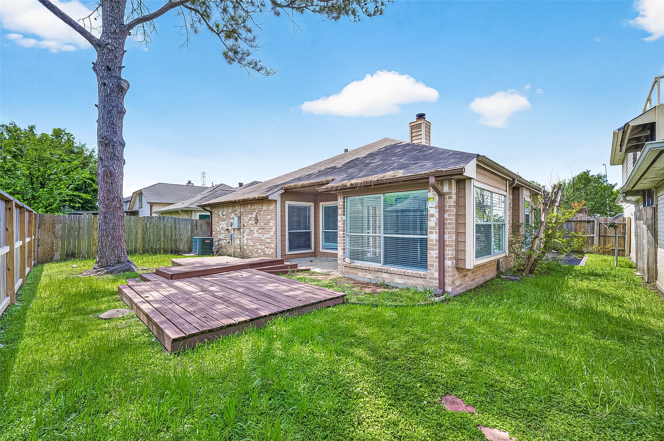 12403 Meadow Ridge Drive Stafford, TX 77477 - Photo 45 of 47 a view of a house with a yard and deck