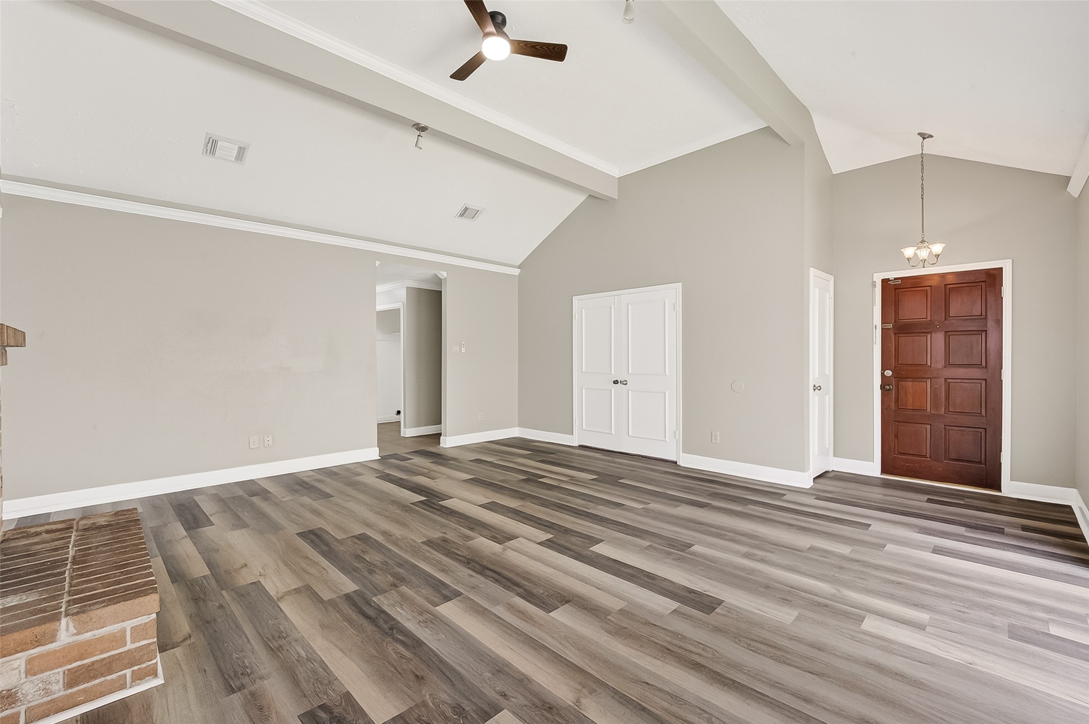 12403 Meadow Ridge Drive Stafford, TX 77477 - Photo 7 of 47 a view of an empty room with wooden floor and a window