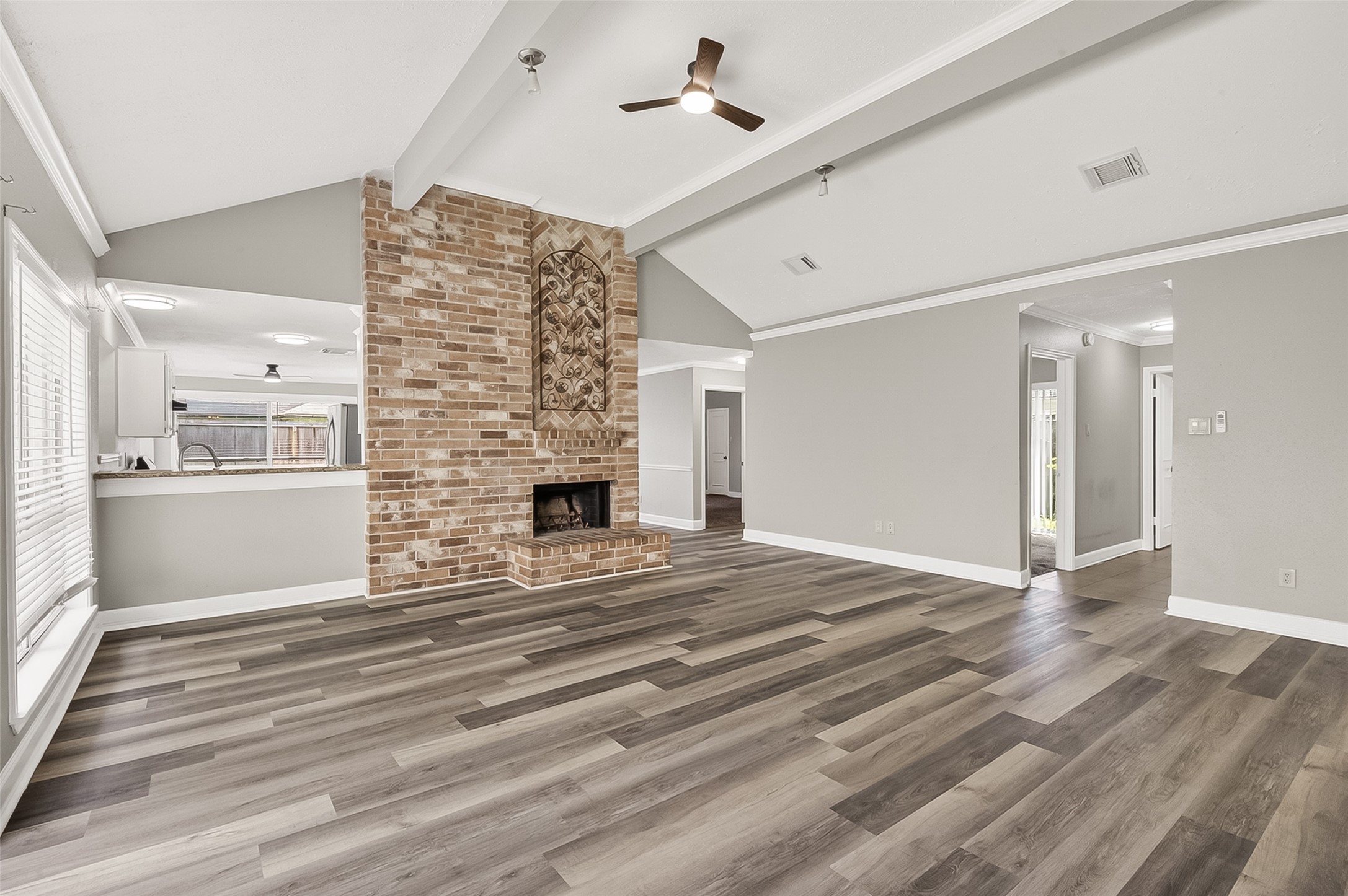 12403 Meadow Ridge Drive Stafford, TX 77477 - Photo 10 of 47 a view of an empty room with wooden floor and a window