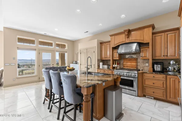 a bathroom with a granite countertop sink mirror and
