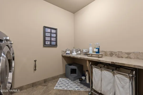 a bedroom with a bed and a table
