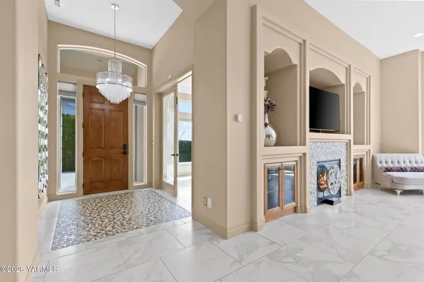 a living room with fireplace furniture and a flat screen tv