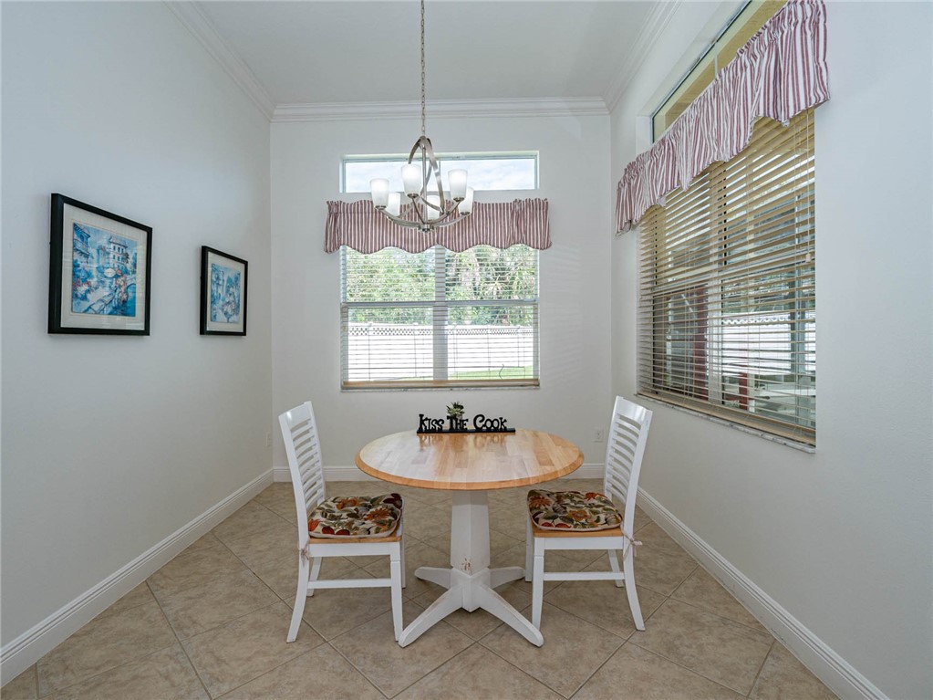 4229 Diamond Square Vero Beach, FL 32967 - Photo 11 of 36 a dining room with furniture and window