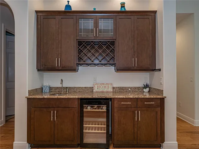 a kitchen with stainless steel appliances granite countertop a sink and cabinets