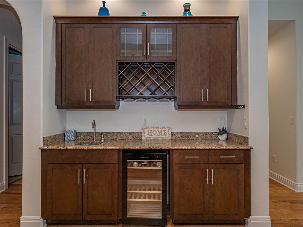 4229 Diamond Square Vero Beach, FL 32967 - Photo 14 of 36 a kitchen with stainless steel appliances granite countertop a sink and cabinets