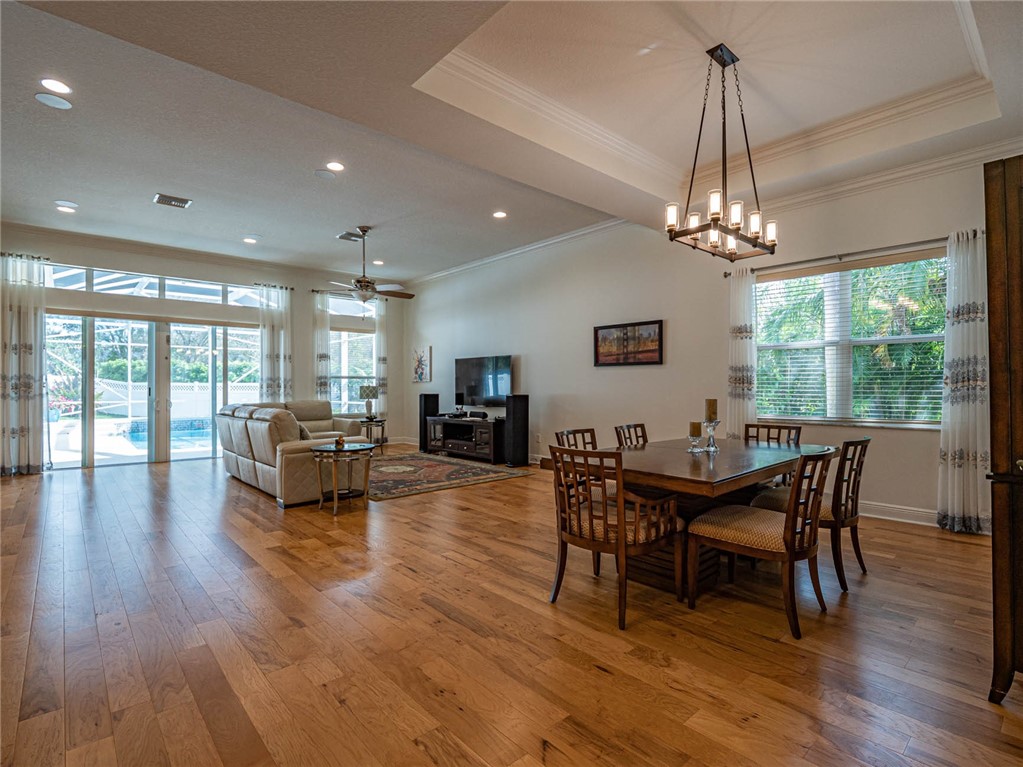 4229 Diamond Square Vero Beach, FL 32967 - Photo 15 of 36 a view of a dining room with furniture window and wooden floor