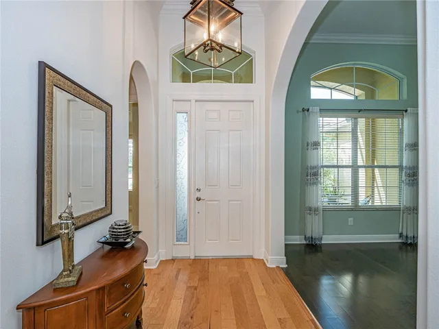 a bedroom with a bed and a mirror