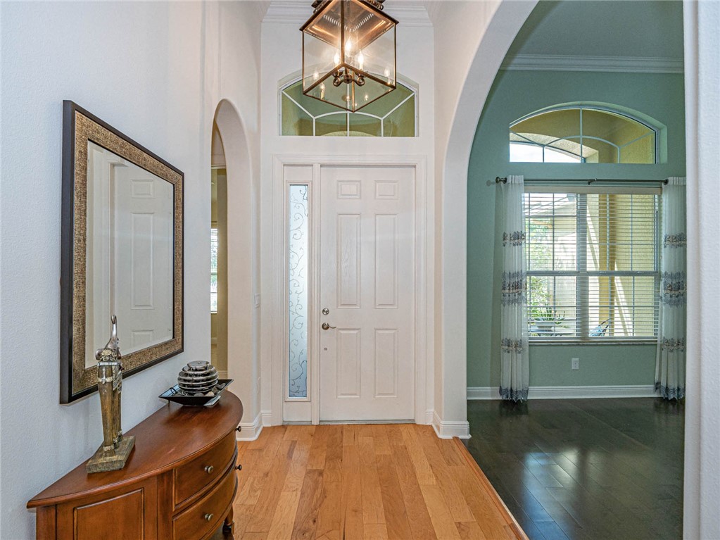 4229 Diamond Square Vero Beach, FL 32967 - Photo 17 of 36 a bedroom with a bed and a mirror