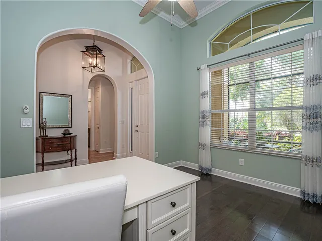 a room with a bed and a mirror on dresser