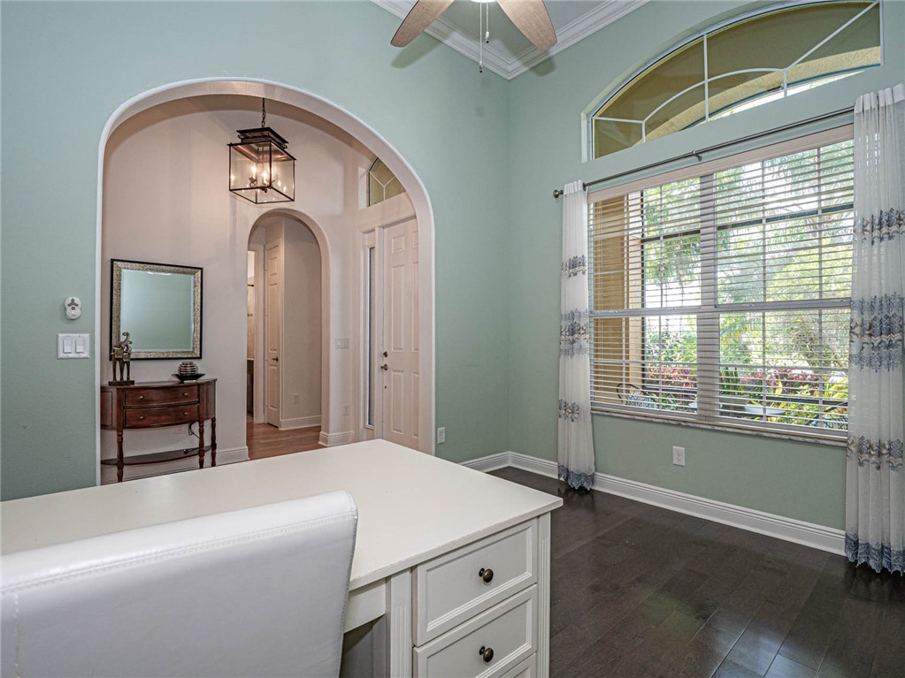4229 Diamond Square Vero Beach, FL 32967 - Photo 19 of 36 a room with a bed and a mirror on dresser