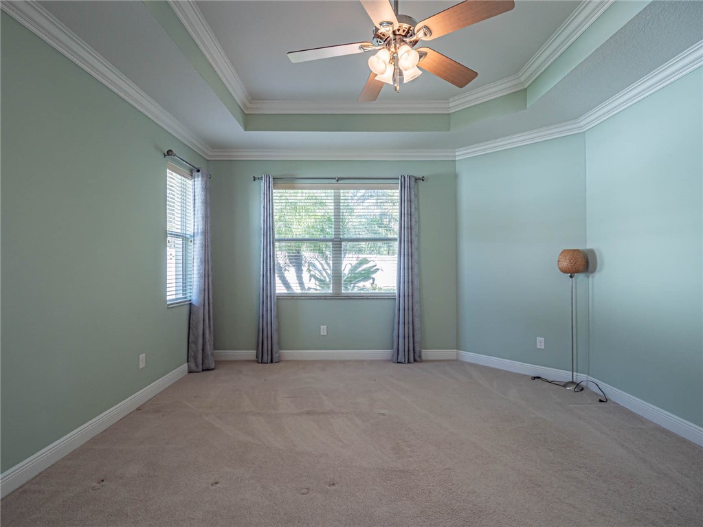 4229 Diamond Square Vero Beach, FL 32967 - Photo 21 of 36 an empty room with windows and fan
