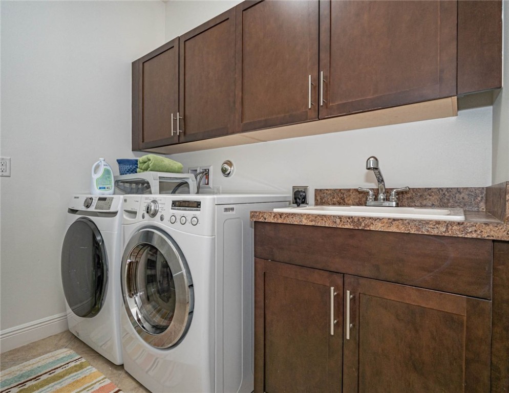 4229 Diamond Square Vero Beach, FL 32967 - Photo 31 of 36 a kitchen with a sink and cabinets