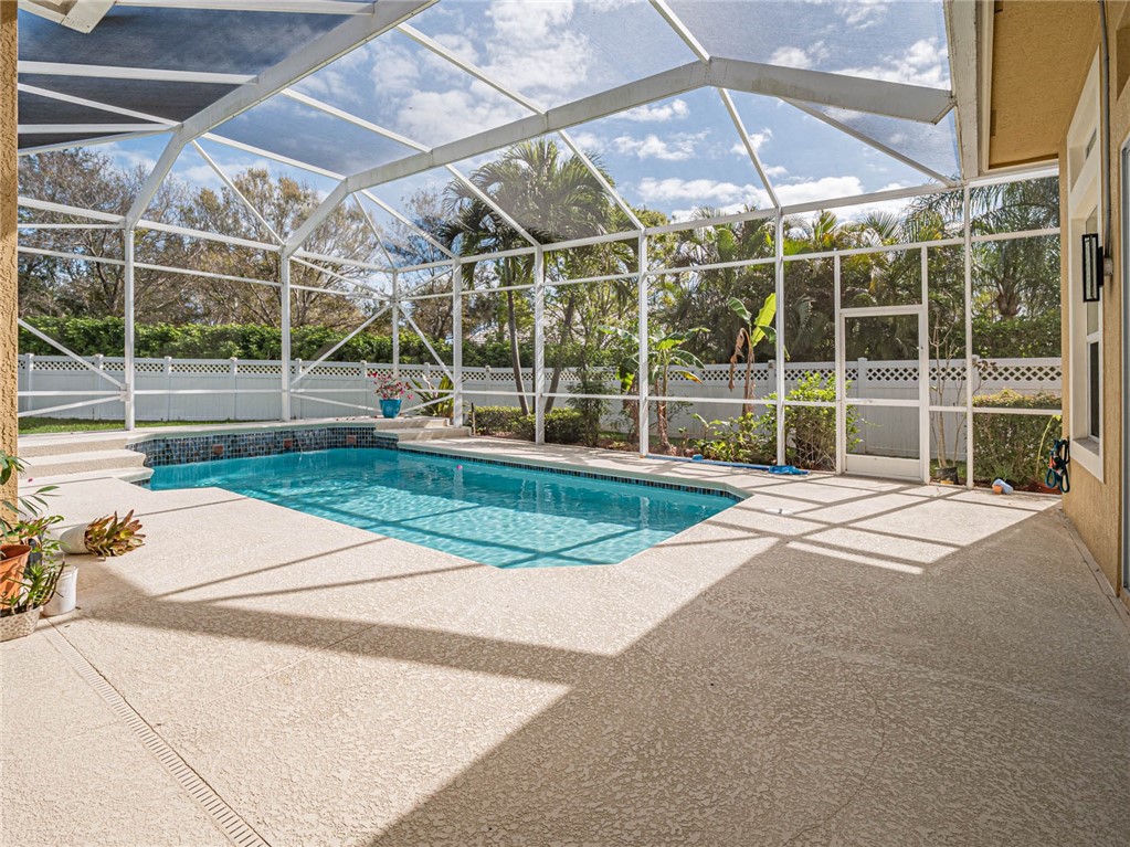 4229 Diamond Square Vero Beach, FL 32967 - Photo 32 of 36 a view of a room with wooden floor and a yard