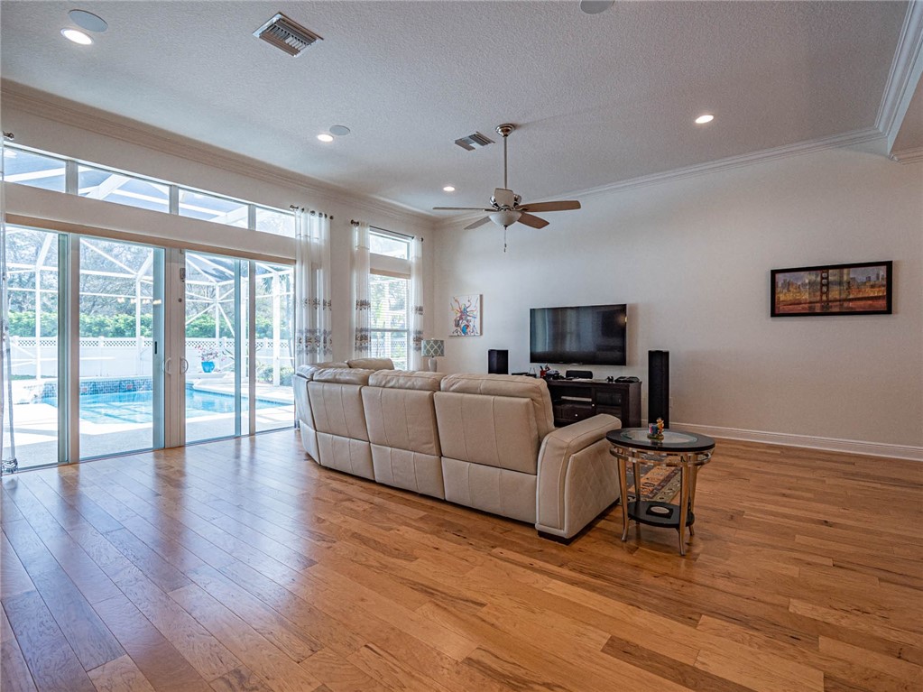 4229 Diamond Square Vero Beach, FL 32967 - Photo 4 of 36 a living room with furniture and a flat screen tv