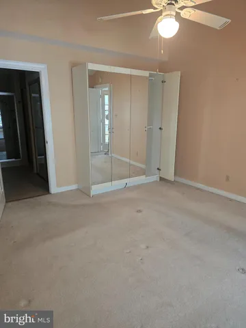 a spacious bathroom with a tub shower and sink