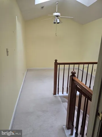 a view of a room with a hanging light