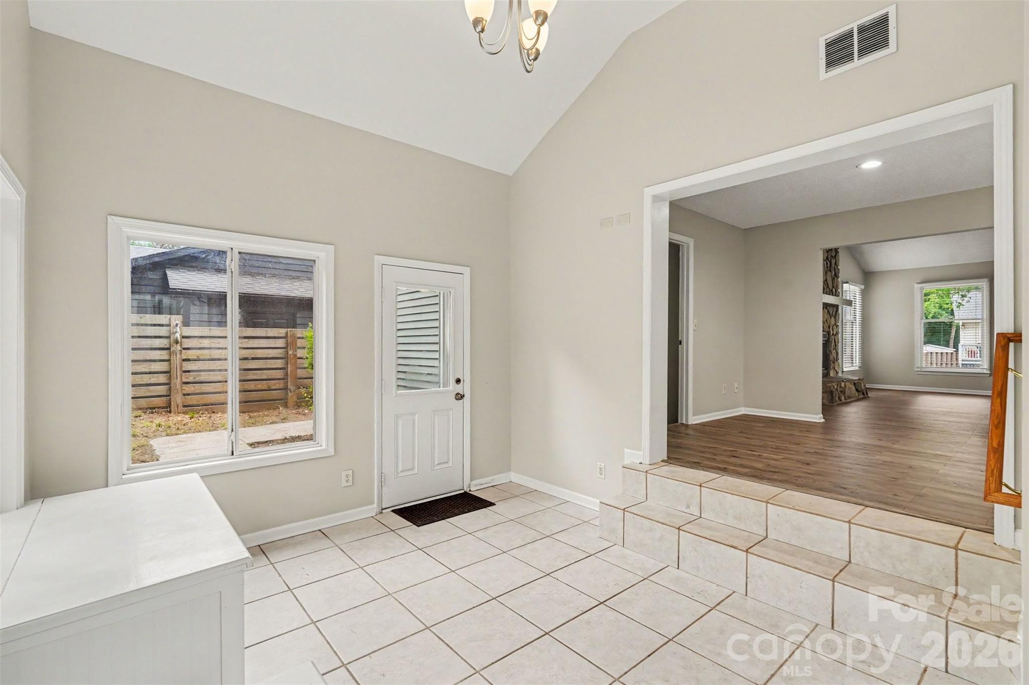 9060 Tulagi Court Tega Cay, SC 29708 - Photo 17 of 29 a view of livingroom with furniture wooden floor and window