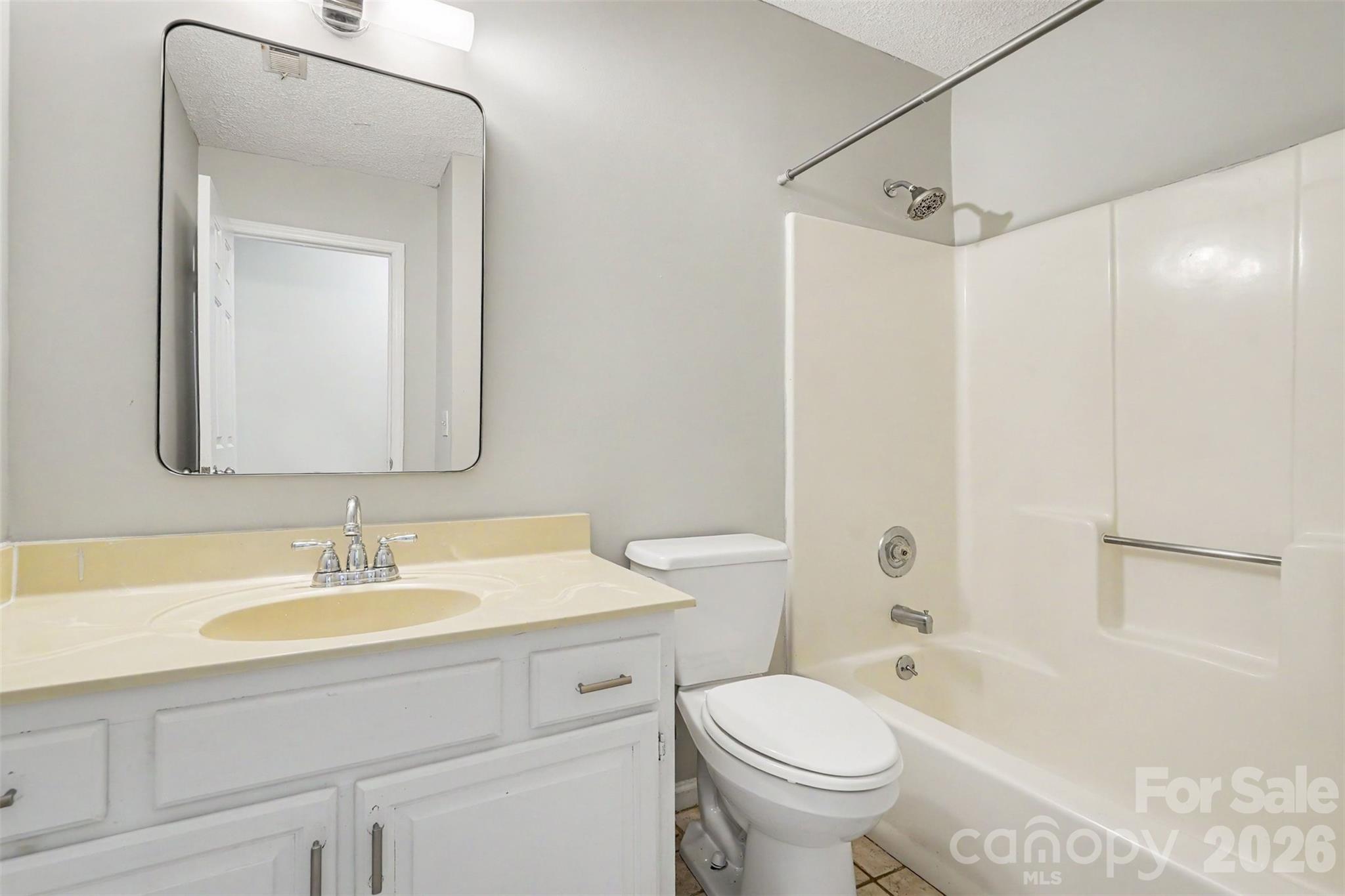 9060 Tulagi Court Tega Cay, SC 29708 - Photo 27 of 29 a bathroom with a sink toilet vanity and shower