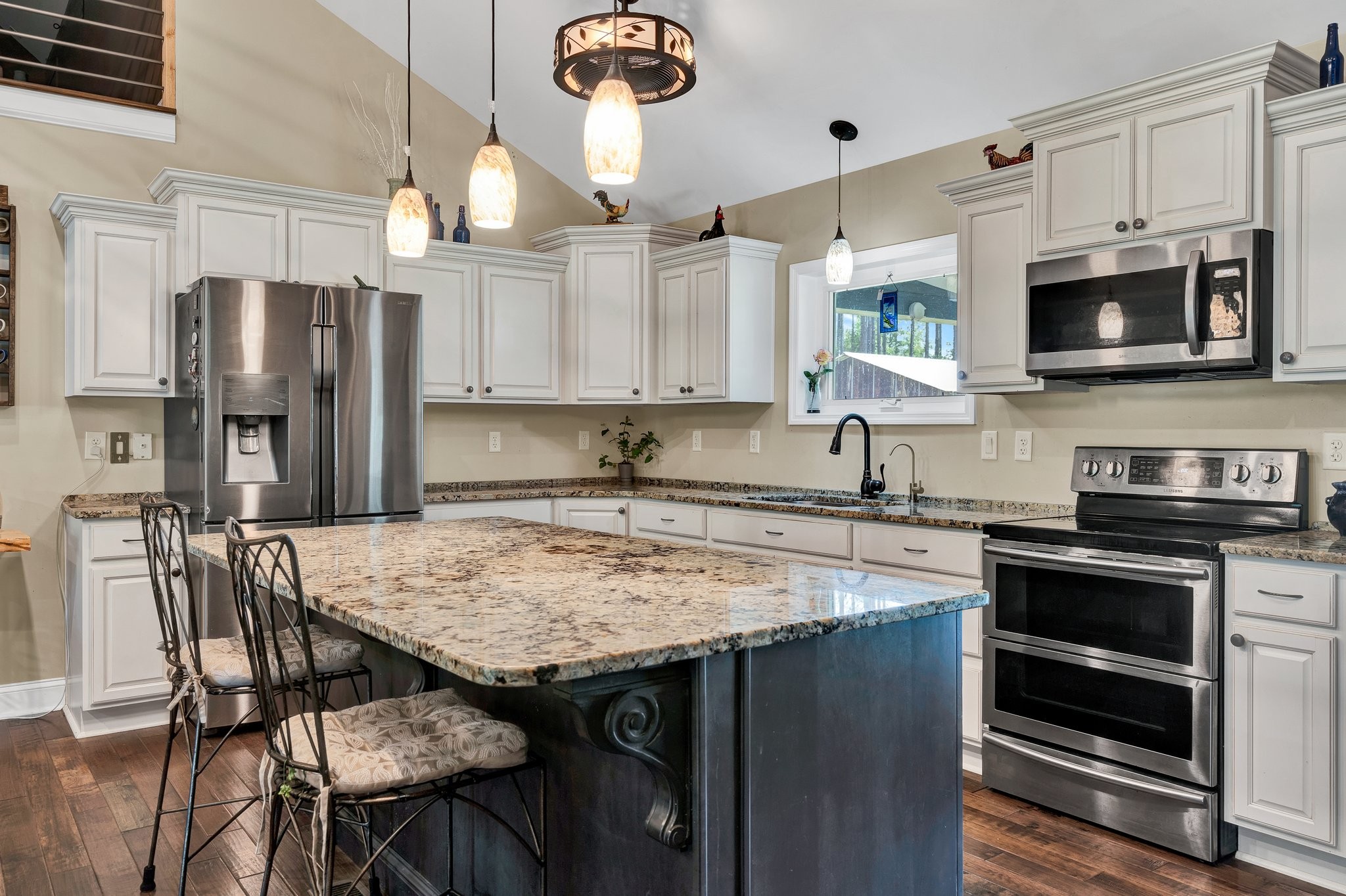 1600 Union Road Southeast Cleveland, TN 37323 - Photo 6 of 68 a kitchen with stainless steel appliances granite countertop a stove refrigerator sink and microwave