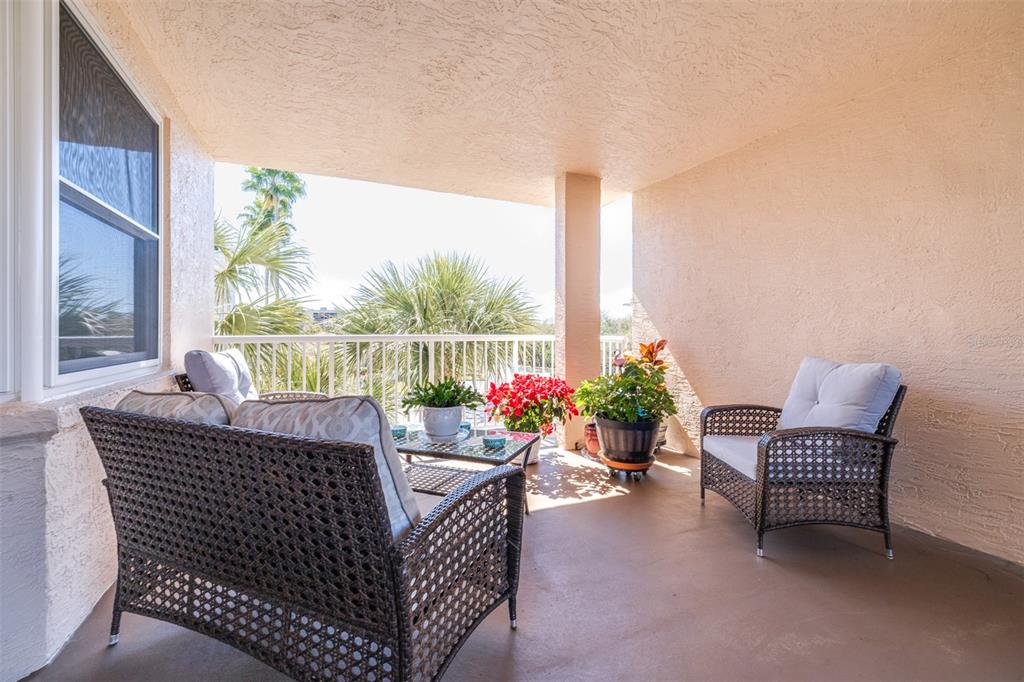 6399 Shoreline Drive, Unit 4206 St. Petersburg, FL 33708 - Photo 3 of 40 a outdoor living space with furniture and garden view