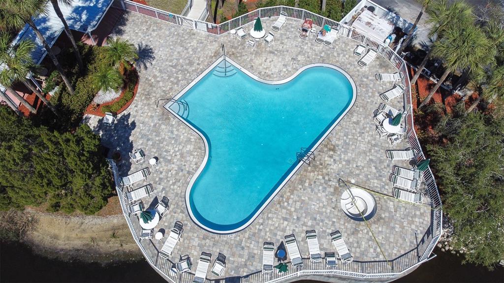 6399 Shoreline Drive, Unit 4206 St. Petersburg, FL 33708 - Photo 32 of 40 an aerial view of a house with swimming pool and outdoor seating