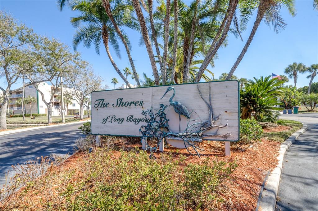 6399 Shoreline Drive, Unit 4206 St. Petersburg, FL 33708 - Photo 33 of 40 a sign on the side of the road