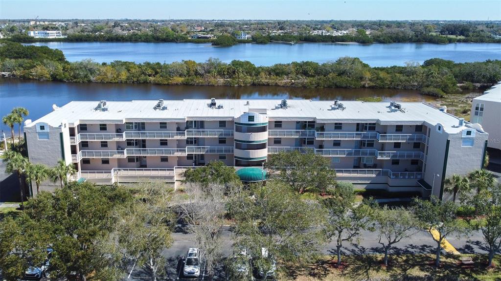 6399 Shoreline Drive, Unit 4206 St. Petersburg, FL 33708 - Photo 35 of 40 a view of a lake with building in front of it