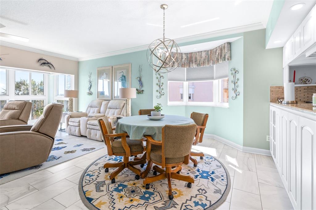 6399 Shoreline Drive, Unit 4206 St. Petersburg, FL 33708 - Photo 10 of 40 a view of a dining room with furniture