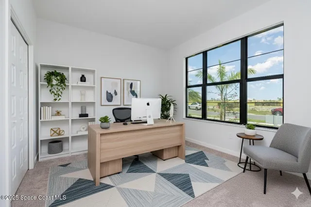 a living room with furniture and a table