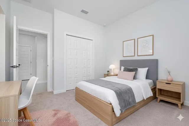 a bedroom with a bed and a chair