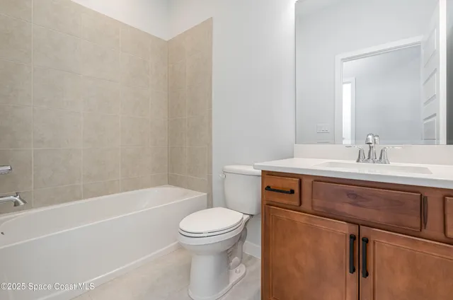 a bathroom with a sink toilet and bathtub