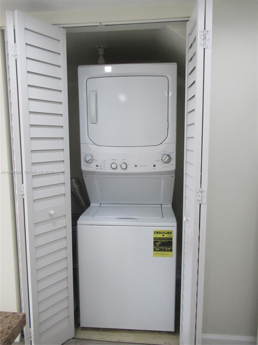 6825 Southwest 45th Lane, Unit 12 Miami, FL 33155 - Photo 16 of 17 a utility room with dryer and washer