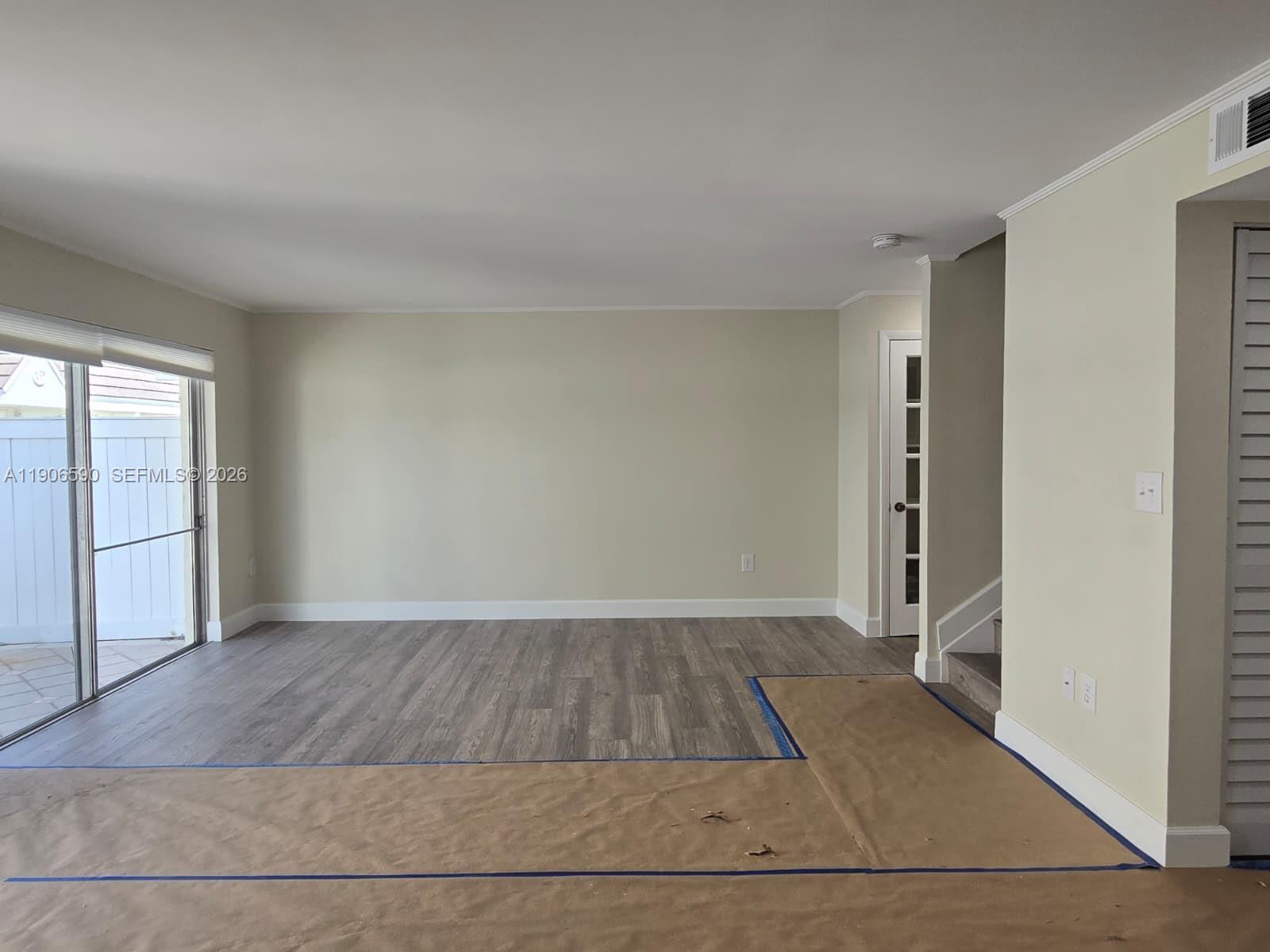 6825 Southwest 45th Lane, Unit 12 Miami, FL 33155 - Photo 3 of 17 an empty room with closet