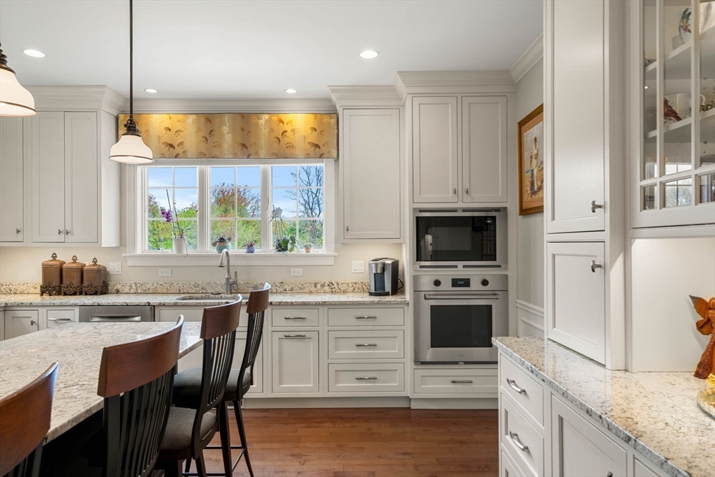 4 Point Shore Overlook Amesbury, MA 01913 - Photo 4 of 42 a kitchen with stainless steel appliances granite countertop a stove a sink and a refrigerator