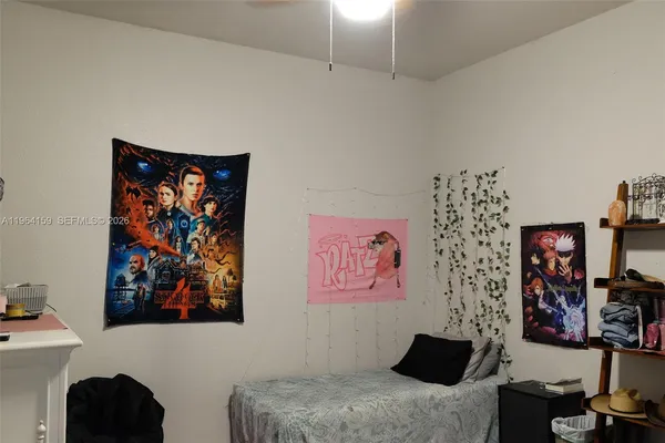 a bedroom with a bed and furniture