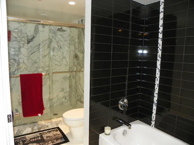 a bathroom with a toilet a sink and a shower