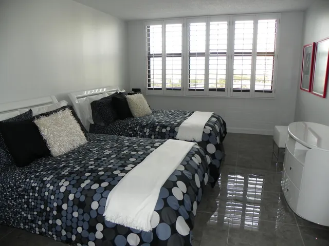 a bedroom with furniture and a window