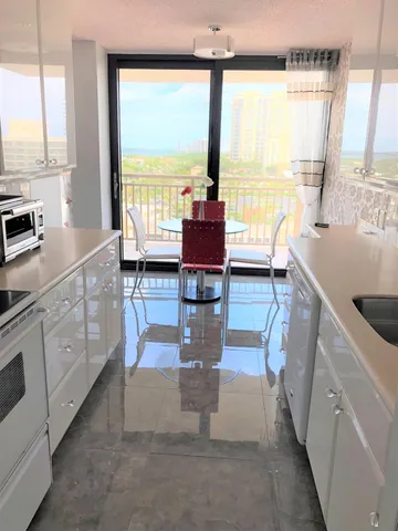 a kitchen with stainless steel appliances granite countertop a stove and a sink