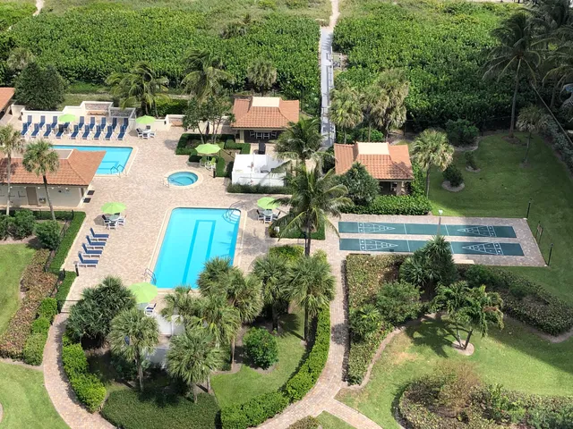 an aerial view of house with yard