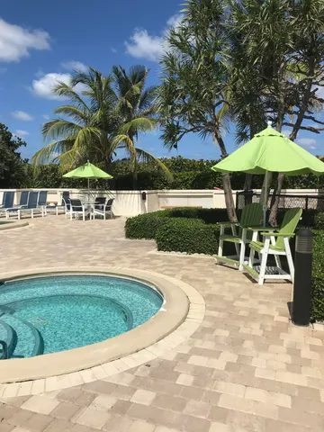 a view of a swimming pool with a patio