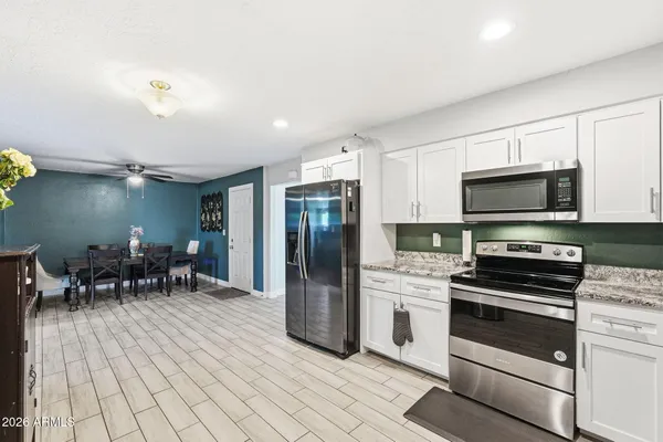 a view of a dining room with furniture and wooden floor